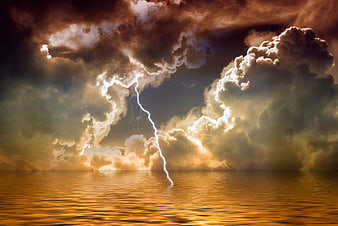 Dramatic Lightning Strike Over Golden Ocean Storm