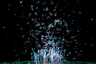 Dynamic Water Splash with Bubbles on Black Background