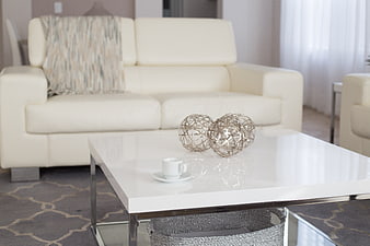 Modern white living room interior with coffee table and sofa