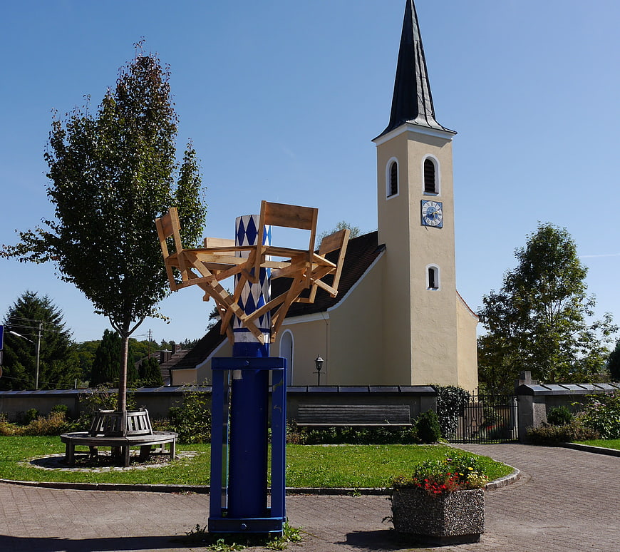 Traditional Bavarian Maypole with Church Background