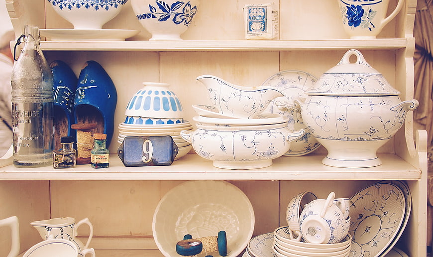 Delft Blue Chinaware and Decor on Wooden Shelves