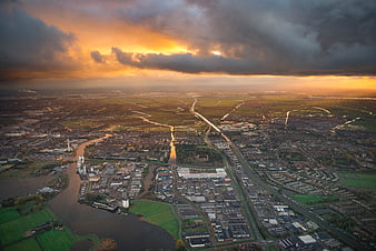 Aerial View of Dutch Landscape at Sunset with Dramatic Clouds