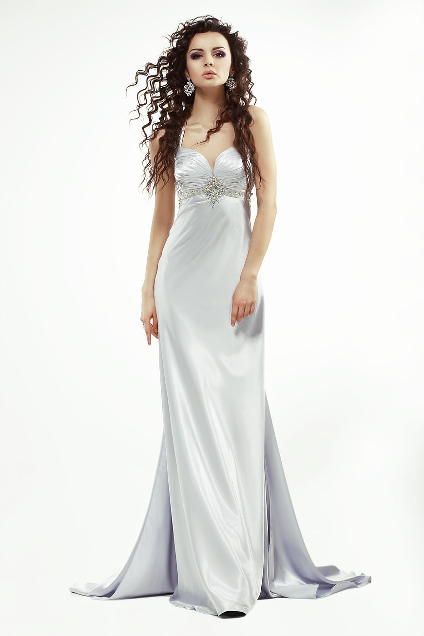 Woman in Elegant Silver Evening Gown