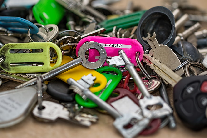 Close-up of a chaotic pile of mixed keys and keychains