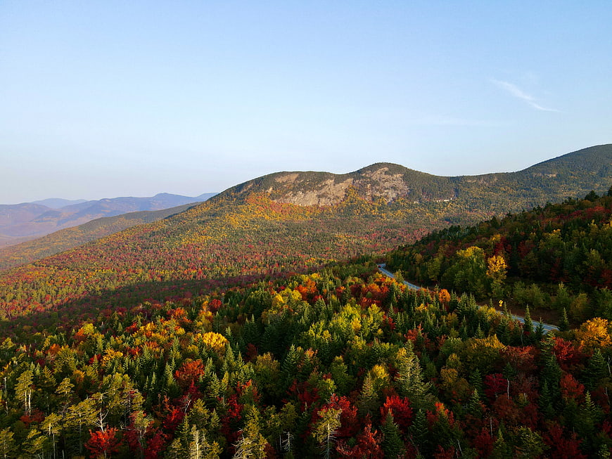 Scenic autumn mountain landscape with colorful foliage and winding road