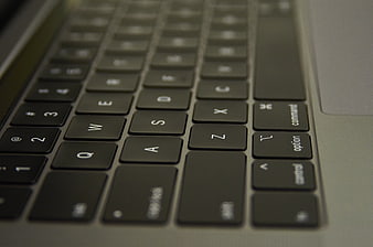 Close-up of laptop keyboard keys with shallow depth of field