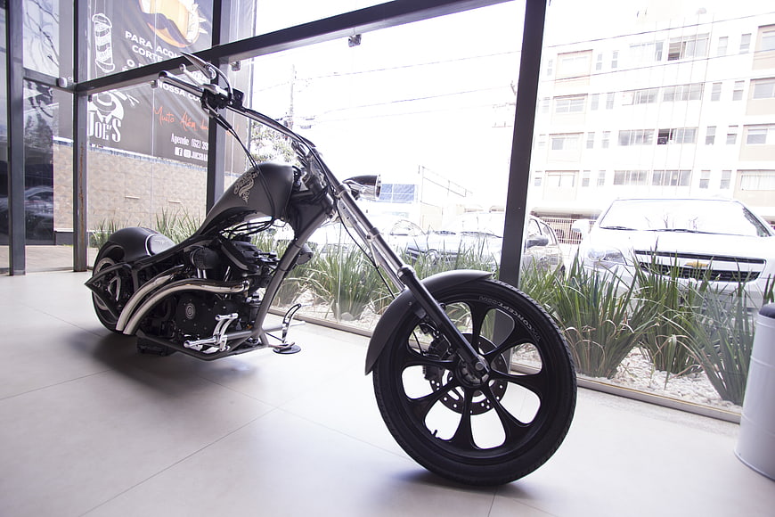 Custom Black Chopper Motorcycle Displayed in Showroom