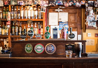 Traditional Irish Pub Bar with Beer Taps and Guinness