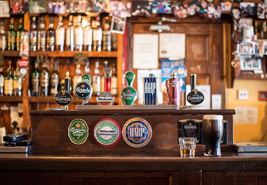Traditional Irish Pub Bar with Beer Taps and Guinness