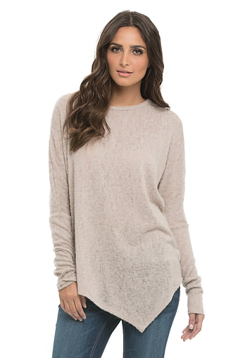 Woman Wearing Beige Knit Sweater And Blue Jeans