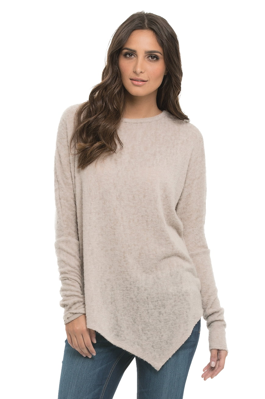 Woman Wearing Beige Knit Sweater And Blue Jeans