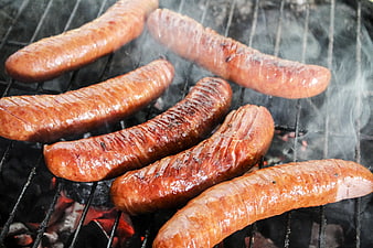 Grilled Sausages on Charcoal BBQ with Smoke
