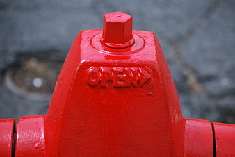 Close-up of red fire hydrant with OPEN text