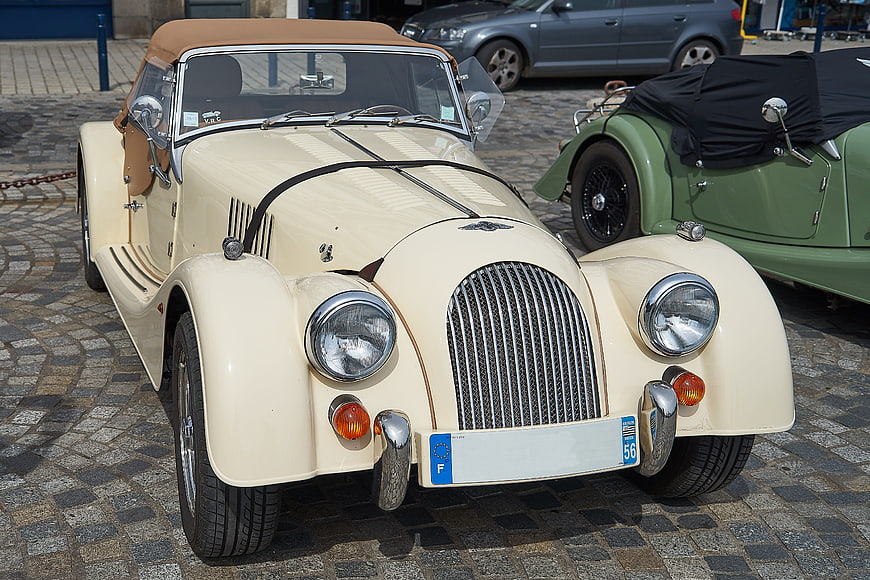 Vintage Cream Convertible Classic Car on Cobblestone