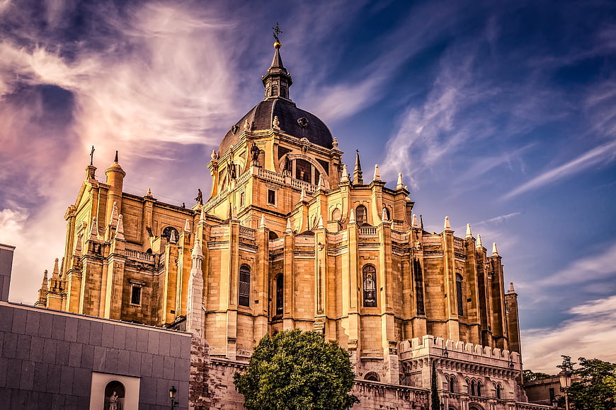 Cathedral of Almudena in Madrid, Spain, dramatic sky and golden hour light