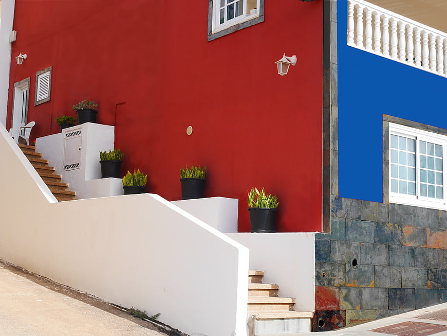 Colorful Red and Blue House Facade with Stairs