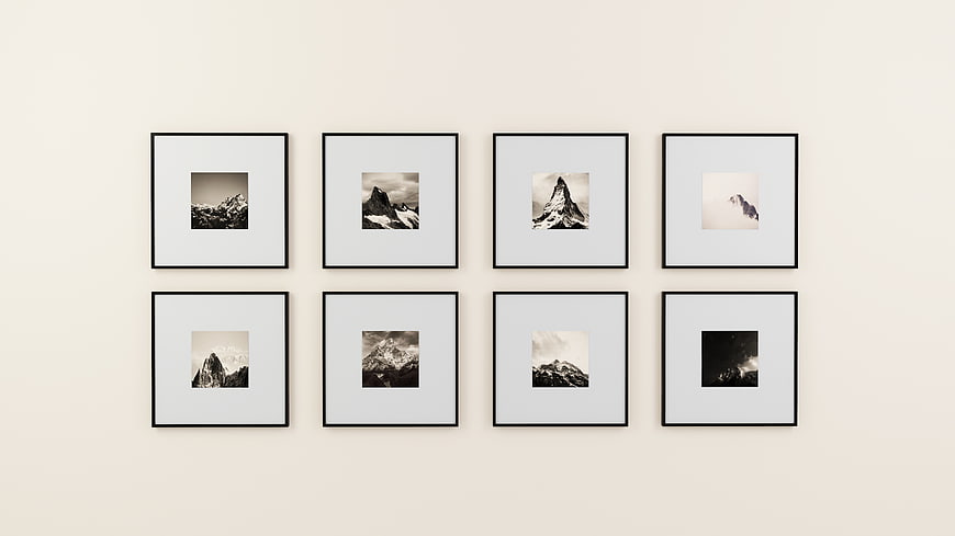 Minimalist gallery wall with black and white mountain prints