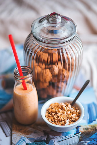 Healthy breakfast with granola, smoothie, and glass jar
