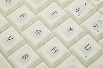 Close-up of white computer keyboard keys with shallow depth of field