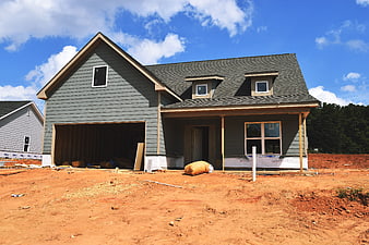 New House Construction Site With Exposed Dirt Yard