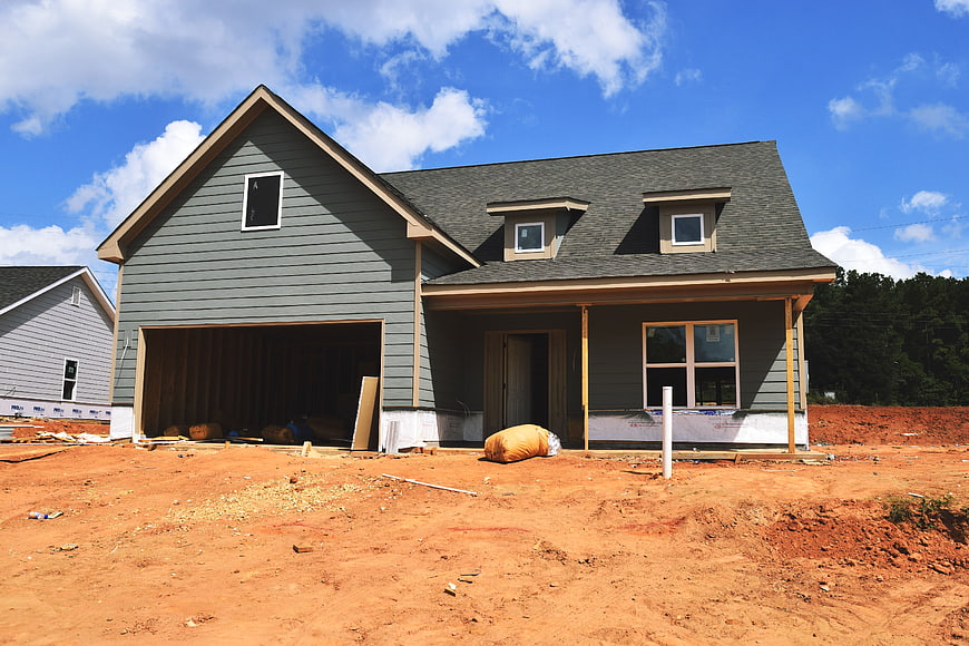 New House Construction Site With Exposed Dirt Yard