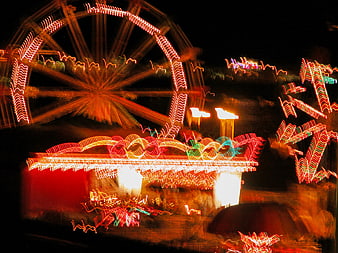 Abstract Light Trails of Carnival Ferris Wheel at Night