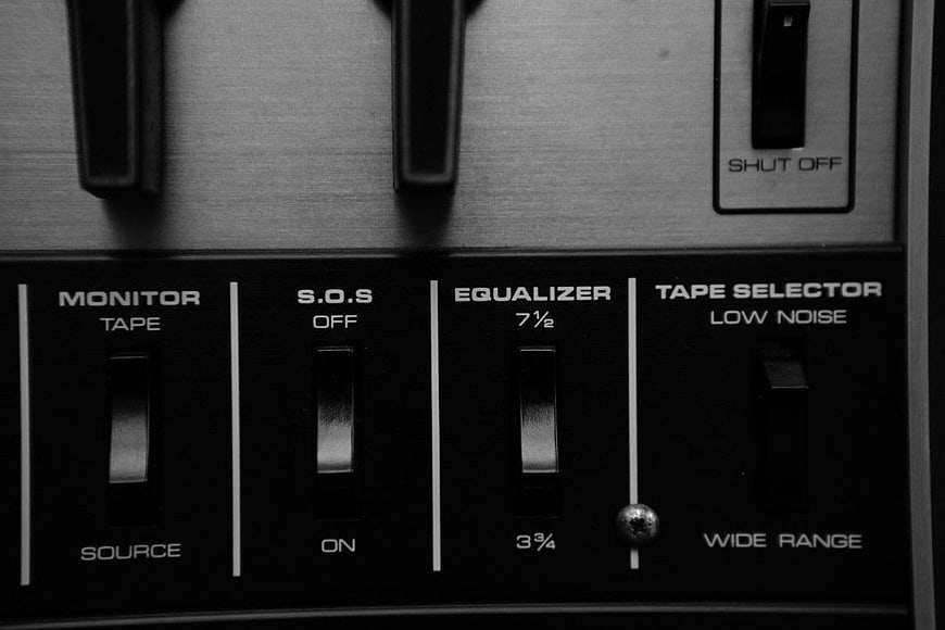 Close-up of vintage audio equipment control panel switches