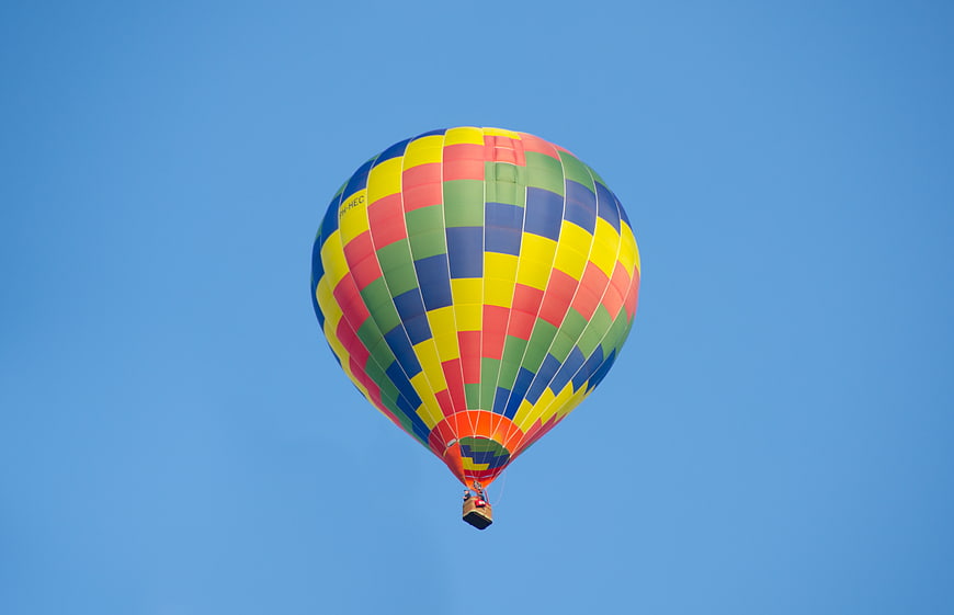 Colorful Hot Air Balloon Flying in Blue Sky