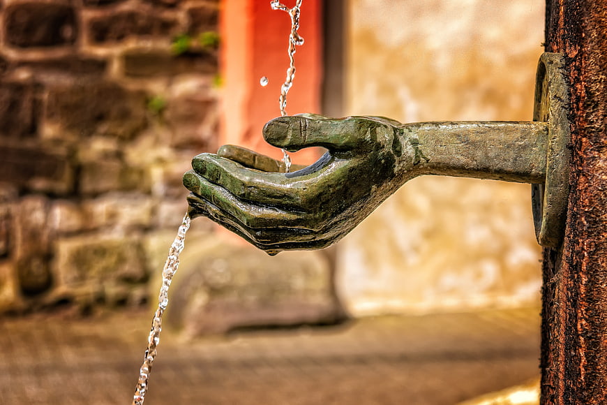 Bronze Hand Sculpture Water Fountain Close Up
