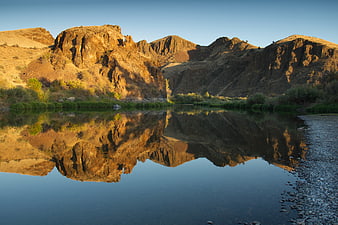 Golden Hour Mountain Reflection in Desert River