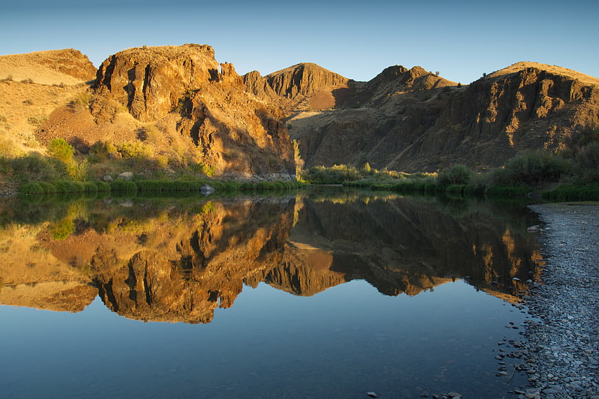 Golden Hour Mountain Reflection in Desert River