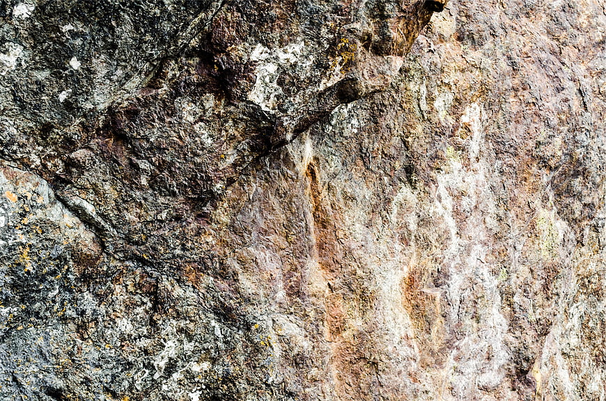 Close-up texture of rough granite rock surface