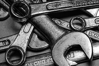 Close-up of vintage metal wrenches and spanners pile