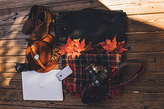 Autumn Travel Flat Lay with Camera, Laptop, and Plaid Shirt