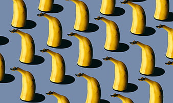 Surreal Pattern of Floating Bananas on Blue Background