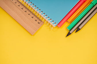 Colorful School Supplies Flat Lay on Yellow Background