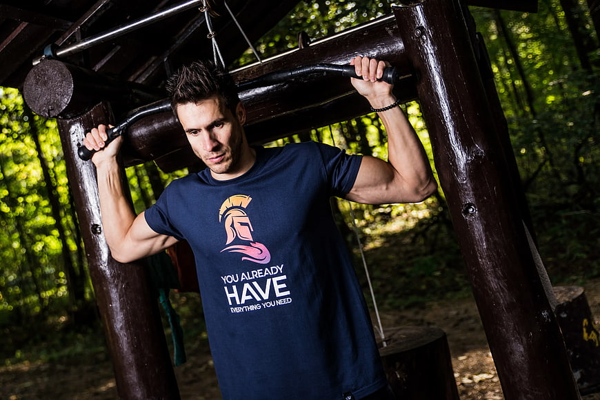 Athletic Man Doing Pull-Ups in Outdoor Forest Gym