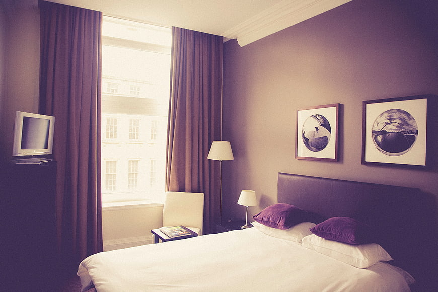 Modern Hotel Bedroom Interior with Purple Accents