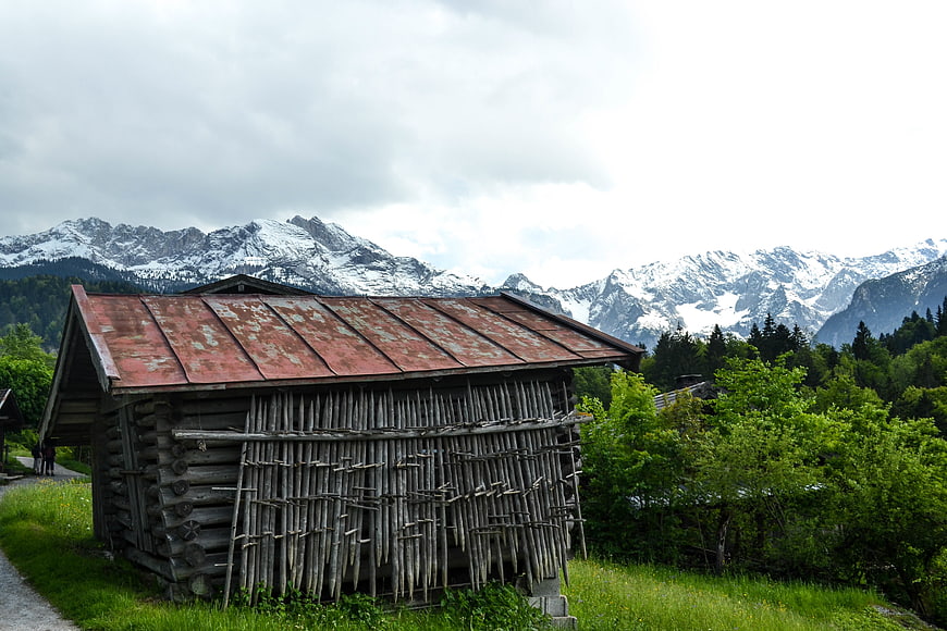 Rustic wooden cabin with mountain backdrop
