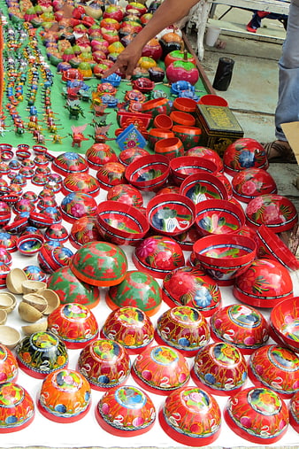 Colorful hand-painted Mexican pottery bowls at market stall
