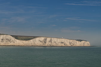 White Cliffs of Dover Landscape with Lighthouse and Blue Sky