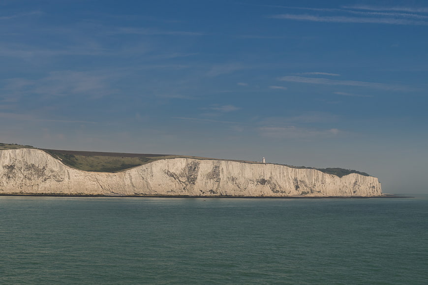 White Cliffs of Dover Landscape with Lighthouse and Blue Sky