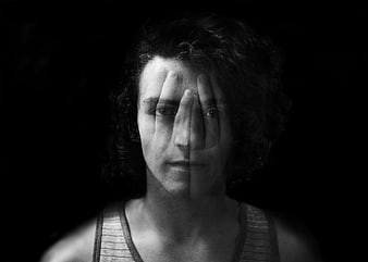 Dramatic Black and White Portrait of Man with Hand Over Face