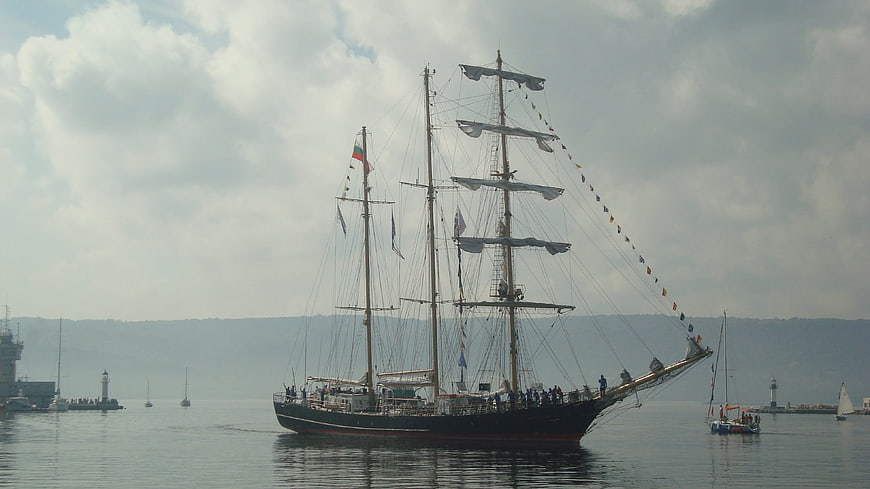 Historic Tall Ship Sailing in Harbor with Bulgarian Flag