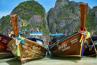 Traditional Thai Longtail Boats Docked in Tropical Bay