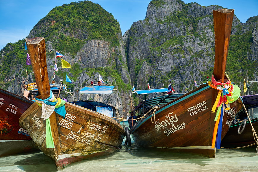 Traditional Thai Longtail Boats Docked in Tropical Bay