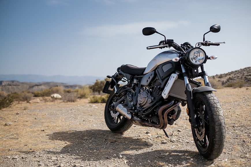 Silver Yamaha Motorcycle on Desert Dirt Road