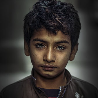 Emotional Portrait of a Young Boy with Intense Gaze