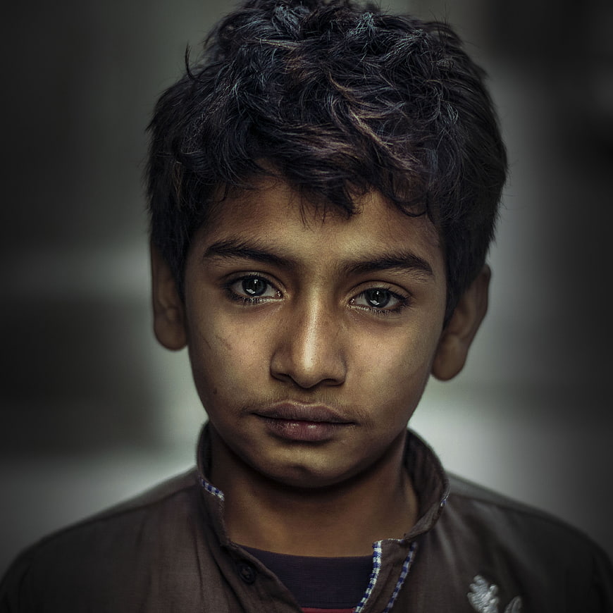 Emotional Portrait of a Young Boy with Intense Gaze