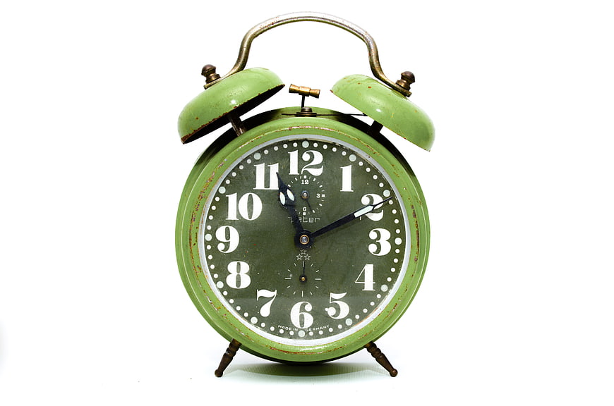 Vintage Green Alarm Clock on White Background